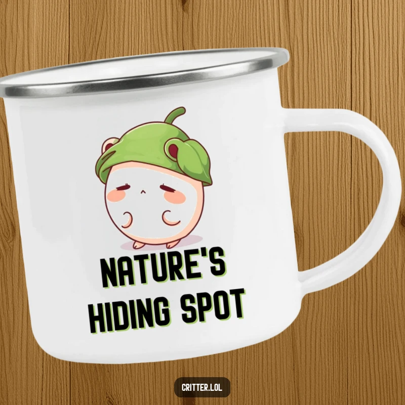 Funny enamel camping mug featuring a shy, round critter wearing a leaf hat and peeking out.