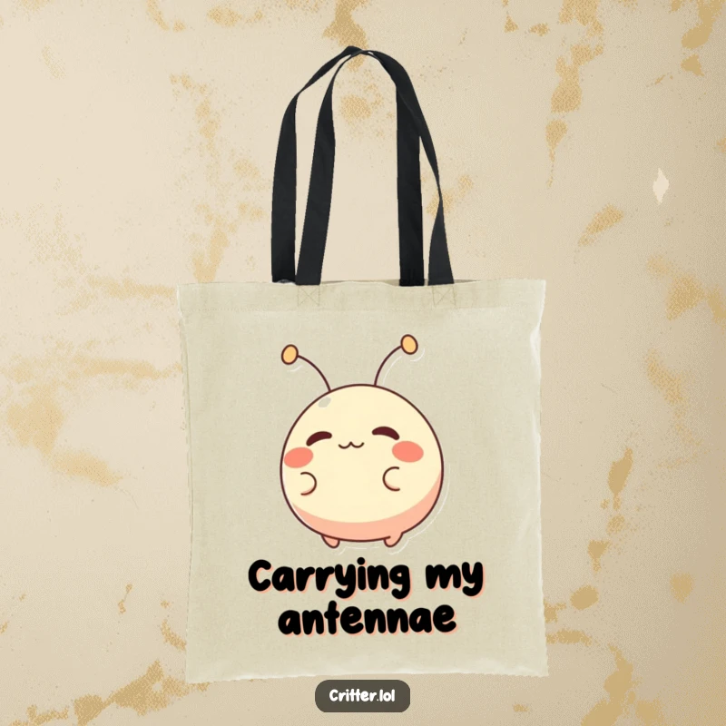 Funny tote bag featuring a small, round creature with antennae wiggling excitedly, perfect for carrying items with a humorous touch.